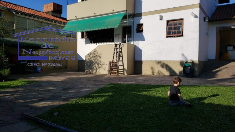 Imagem Casa com 4 Quartos à Venda, 268 m² em Cavalhada - Porto Alegre